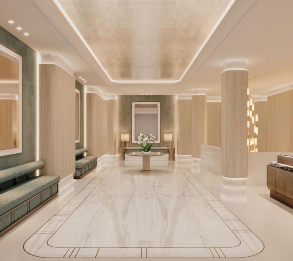 An bright, elegant lobby with seating along a wall 