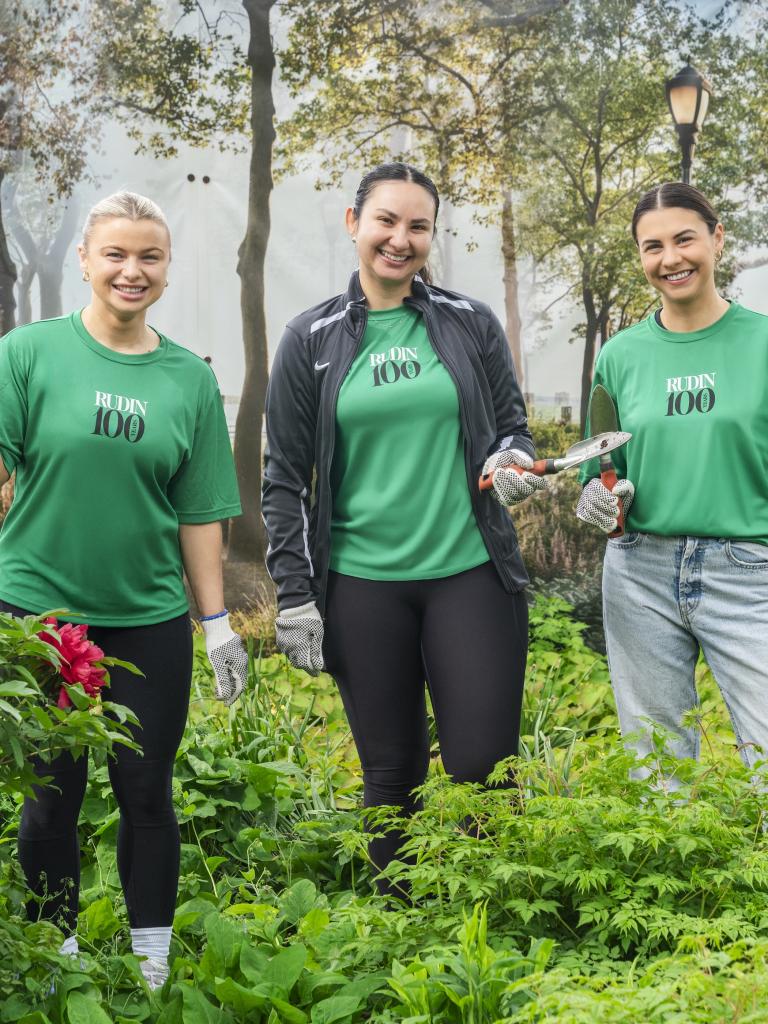 3 employees during the earth day volunteer event in Battery Park