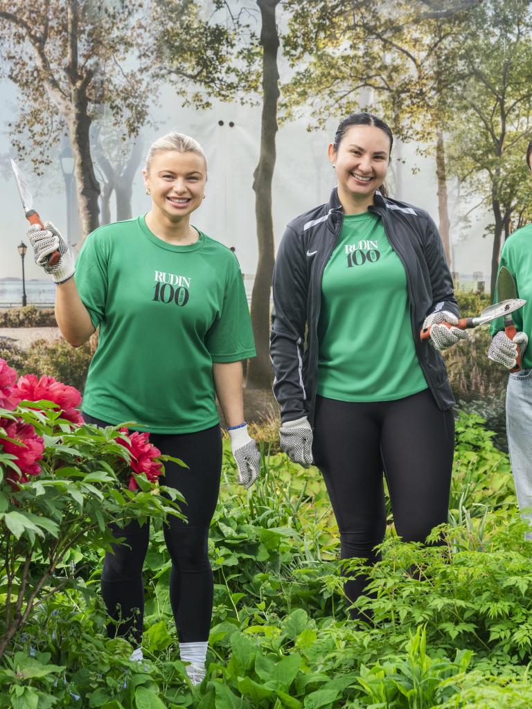 3 employees during the earth day volunteer event in Battery Park