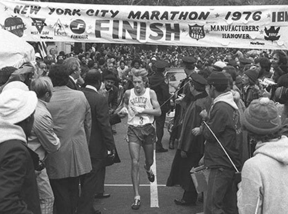 A runner crosses the finish line of his race. Source: NY Daily News