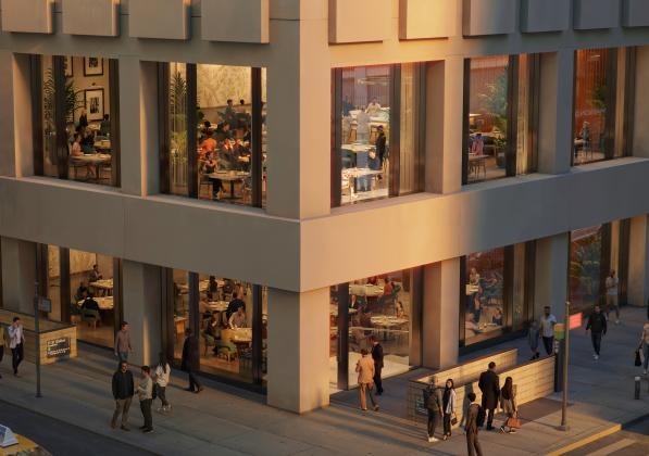 A restaurant seen through large windows on a city street corner