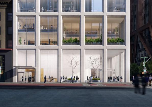 A building with rows of tall windows viewed from the street