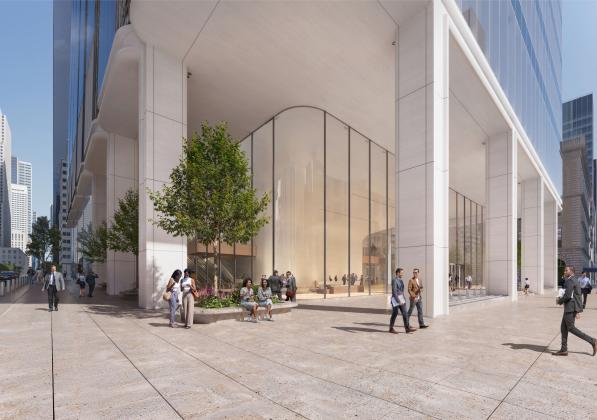 A city sidewalk covered by the overhang of a building supported by white columns