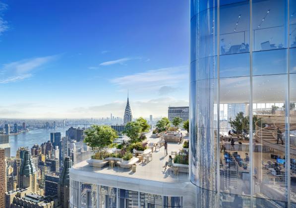 A patio on a tall building with the New York City skyline in the background