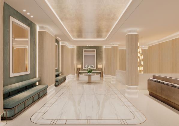 An bright, elegant lobby with seating along a wall 