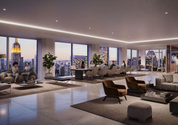 A lounge area with seating and large windows overlooking the city