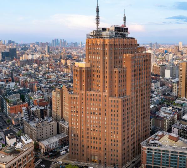 Aerial view of 32 Avenue of the Americas exterior facade, an office space in Manhattan.