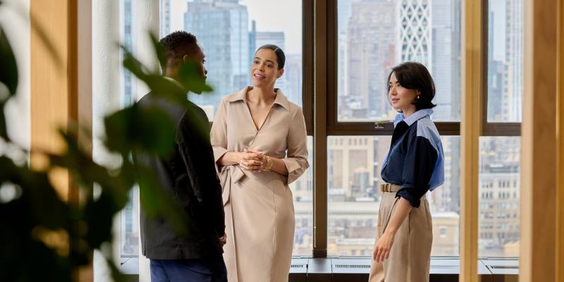 People talking at work in an office building in New York City