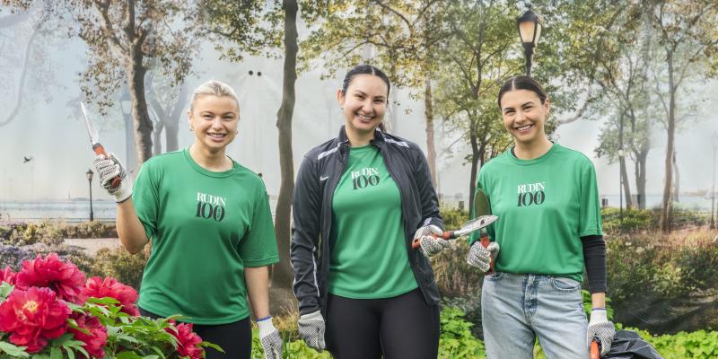 3 employees during the earth day volunteer event in Battery Park