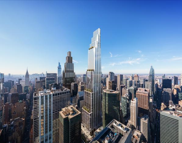 An aerial view of the top of 350 Park Avenue surrounded by other buildings with a blue sky behind it