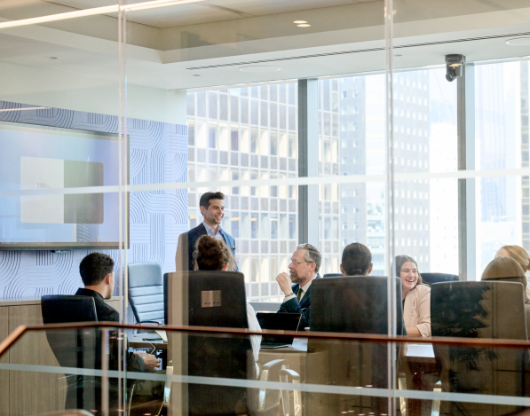 A business man gives a presentation in a sleek meeting room