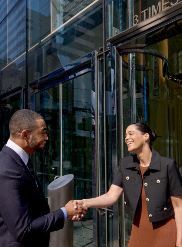 Devon and guest shaking hands