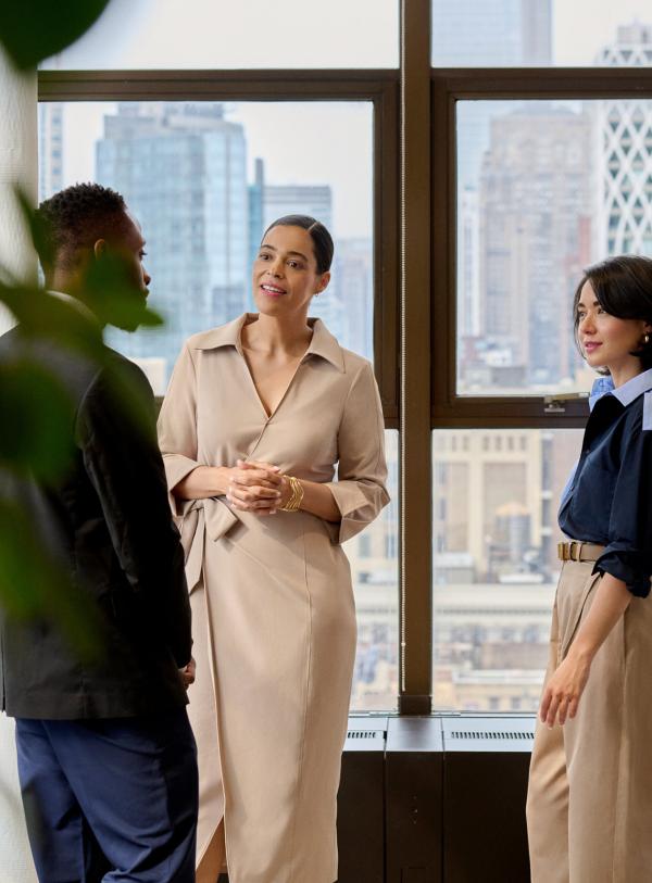 People talking at work in an office building in New York City
