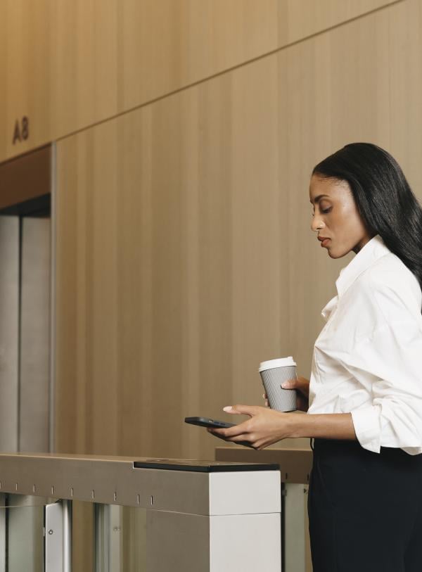 Person scanning pass to access building