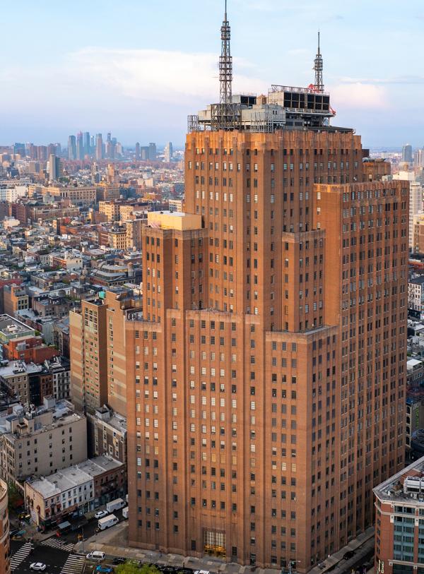 Aerial view of 32 Avenue of the Americas exterior facade, an office space in Manhattan.