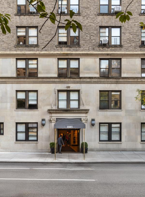 View of the entrance to the 1085 Park Avenue apartment building from across the street