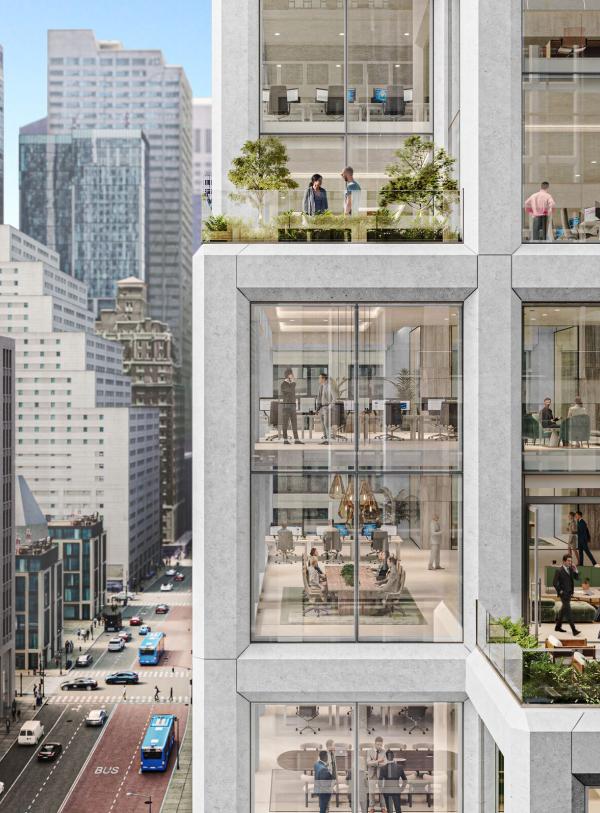 A tall office building with large windows and terraces overlooking the city